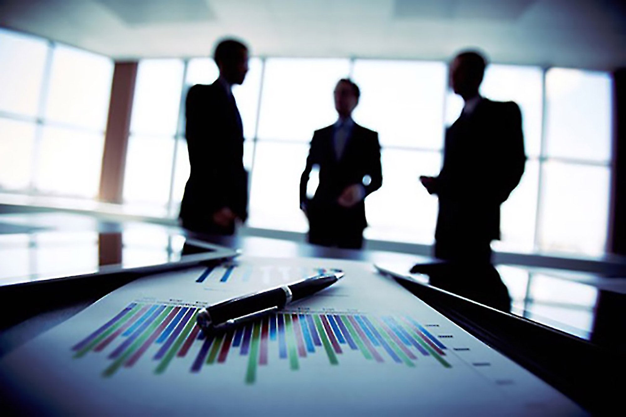 Investors reviewing performance charts